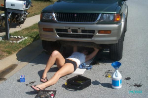 Hot chick working on her car