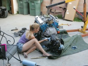 girl working on engine pic