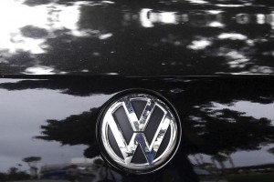 Trees are reflected in the paint of a diesel Volkswagen Passat TDI SEL in Santa Monica