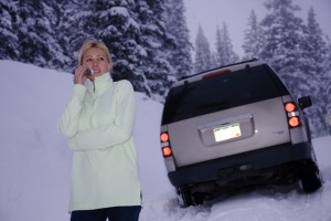 Woman Stranded in Snow Using Cell Phone