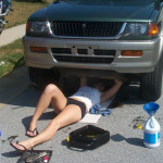 Hot chick working on her car