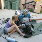 girl working on engine pic