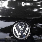 Trees are reflected in the paint of a diesel Volkswagen Passat TDI SEL in Santa Monica