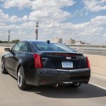 2017-Cadillac-ATS-Coupe-rear-three-quarters-in-motion-2