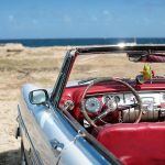 cuban vintage car parked on the seacost in havana